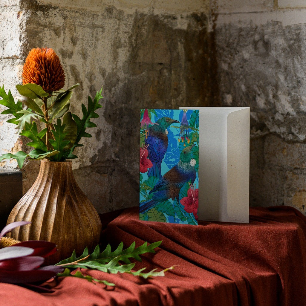 FLOX Tūī & Pūriri greeting card styled on a shelf
