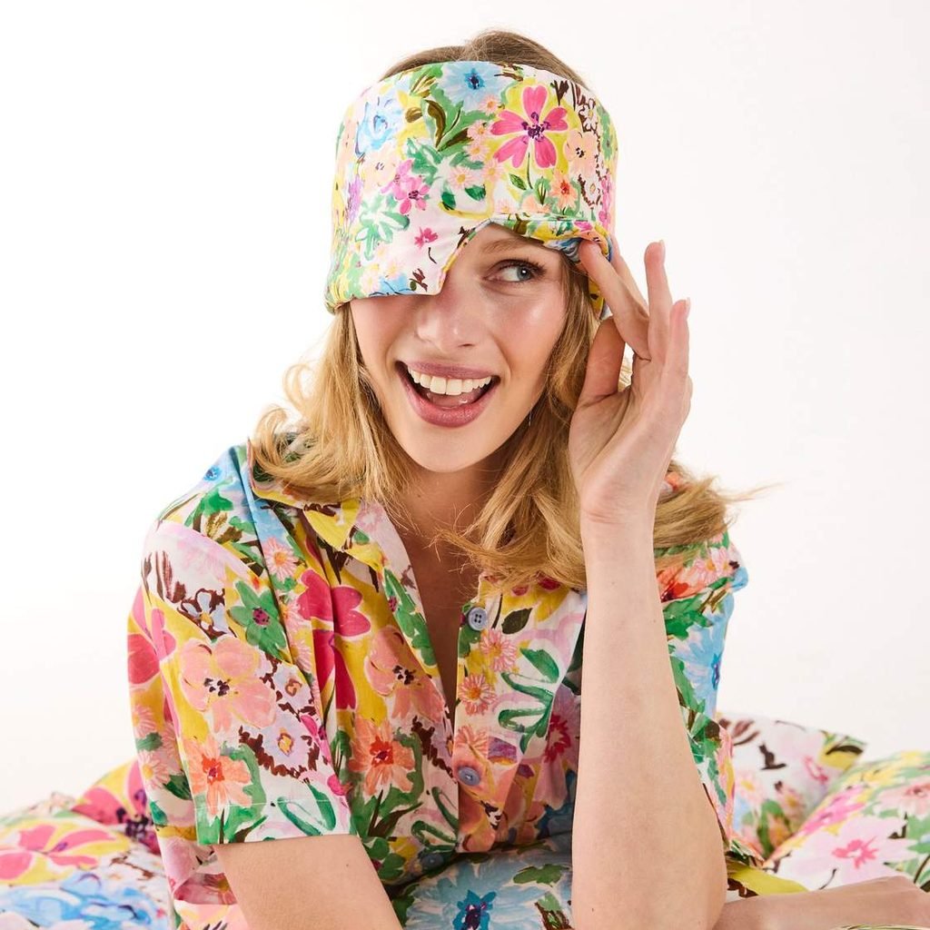 Smiling woman with the Alfresco eye mask pushed up