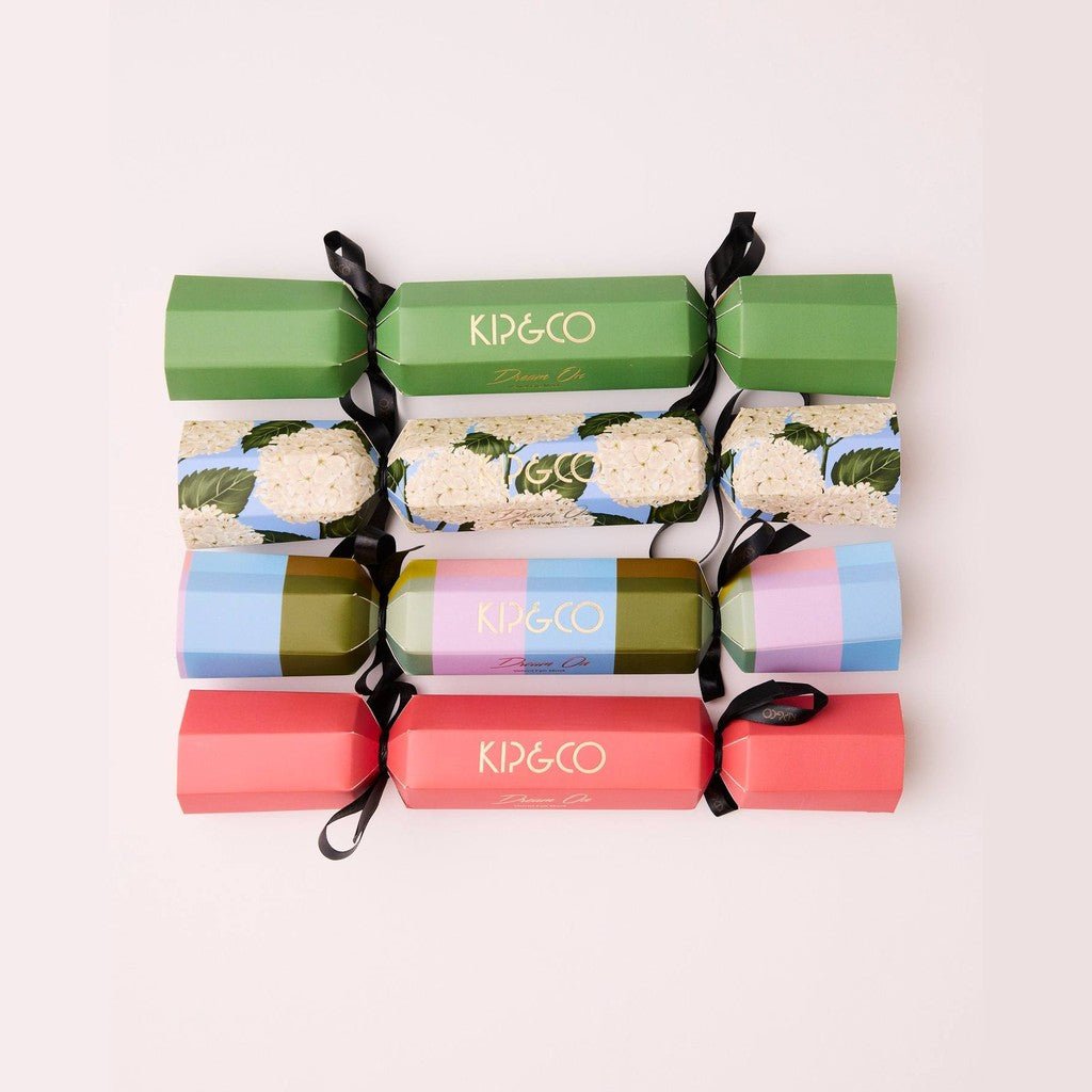 Four Christmas Slumber bon bons tied with black ribbon