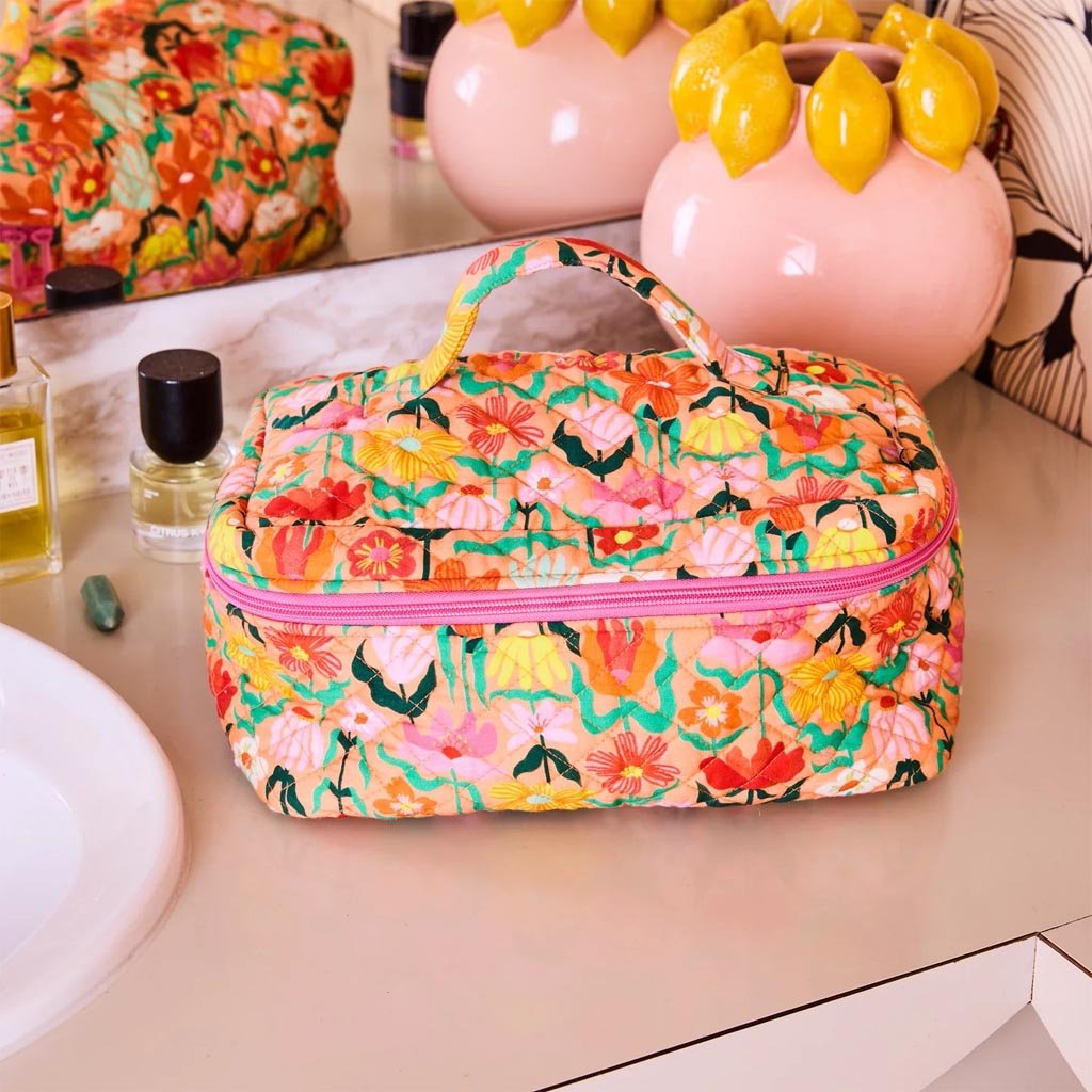 Kip & Co | Popping Flowers Peach Quilted Toiletry Case - Cove. Beach Essentials