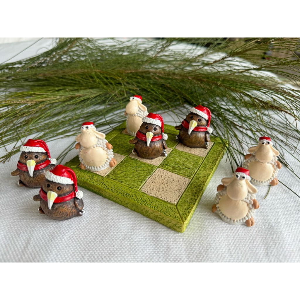 Christmas tic tac toe game set out with pine foliage