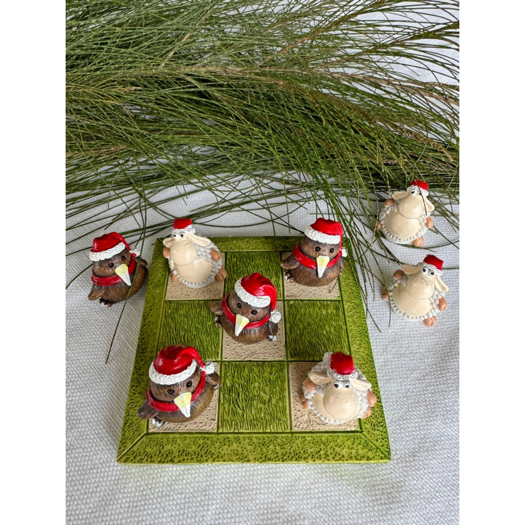 Kiwi and sheep Christmas tic tac toe pieces on the board