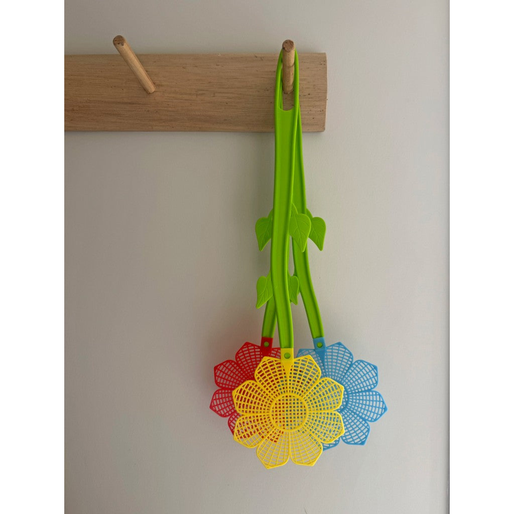 Flower fly swats hanging from a hook