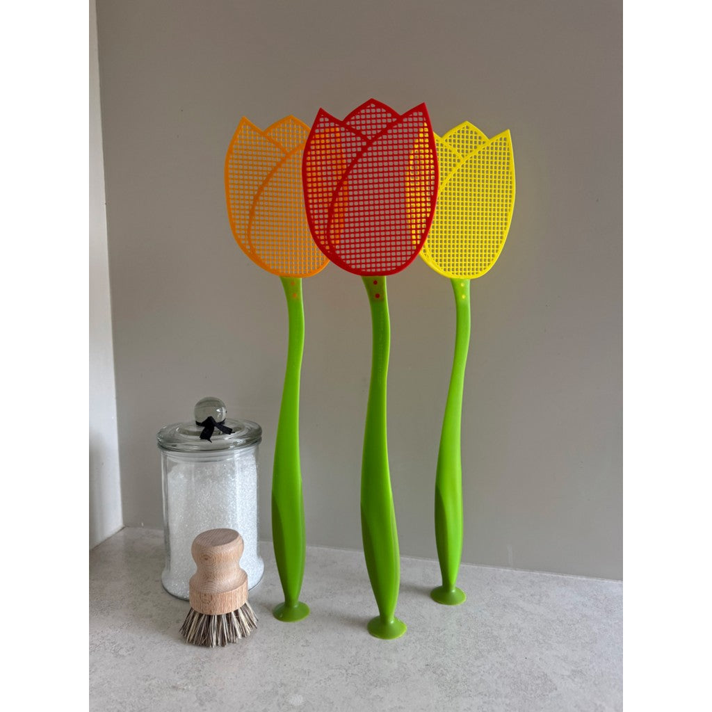 Tulip fly swats standing in a glass jar