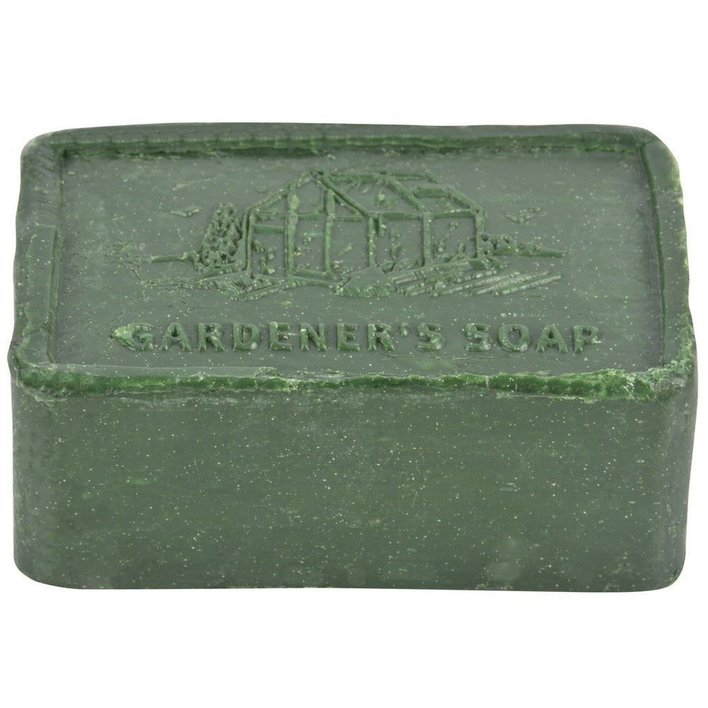 Green bar of gardeners soap on white