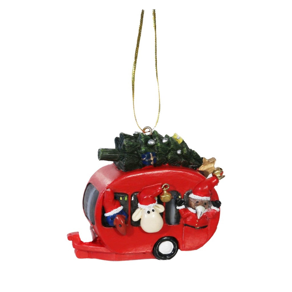 Red caravan Christmas ornament with a tree on the roof