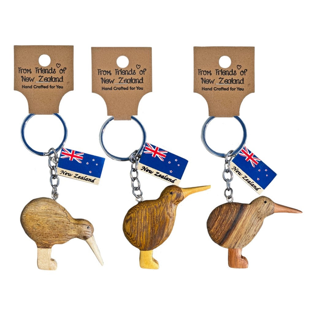Three wooden kiwi keyrings on their gift cards