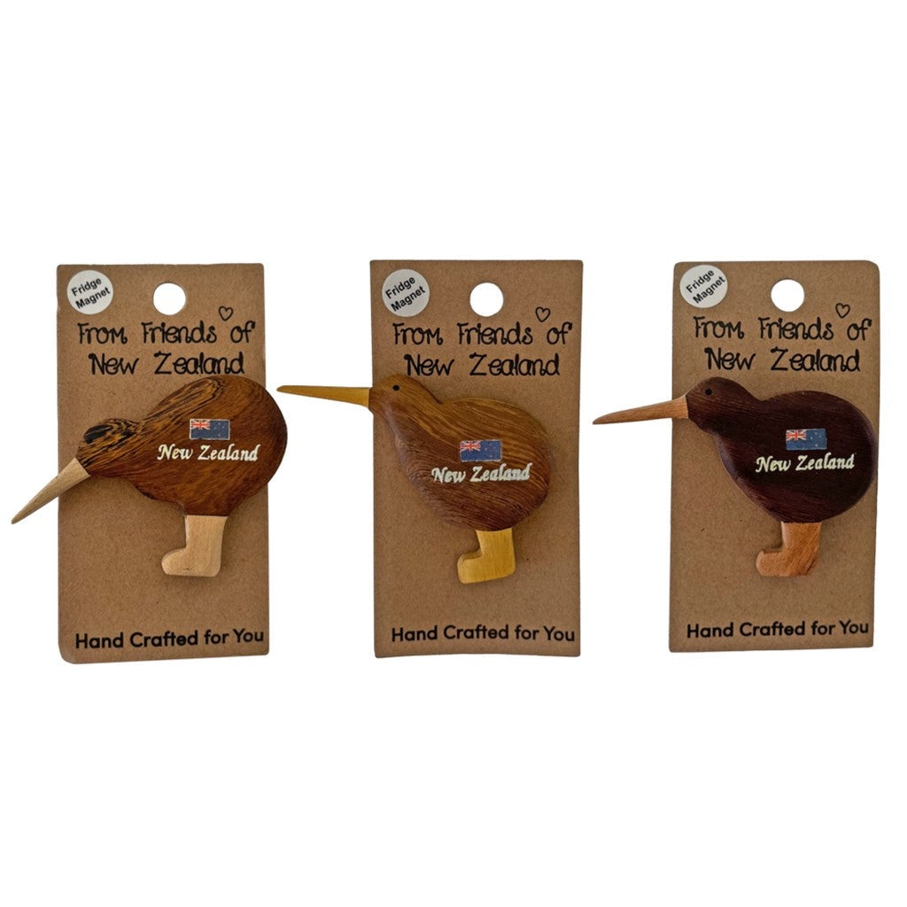 Three wooden kiwi magnets on their gift cards