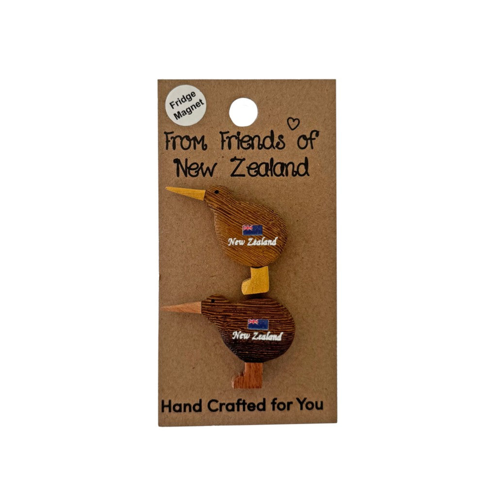 Mini wooden kiwi magnets on a gift card