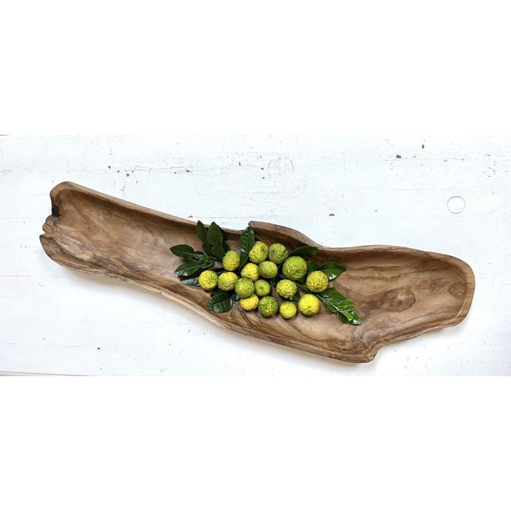 Organic teak long bowl with green olives on white