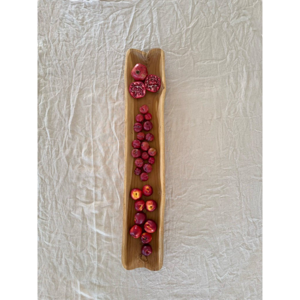 Teak long bowl filled with flowers