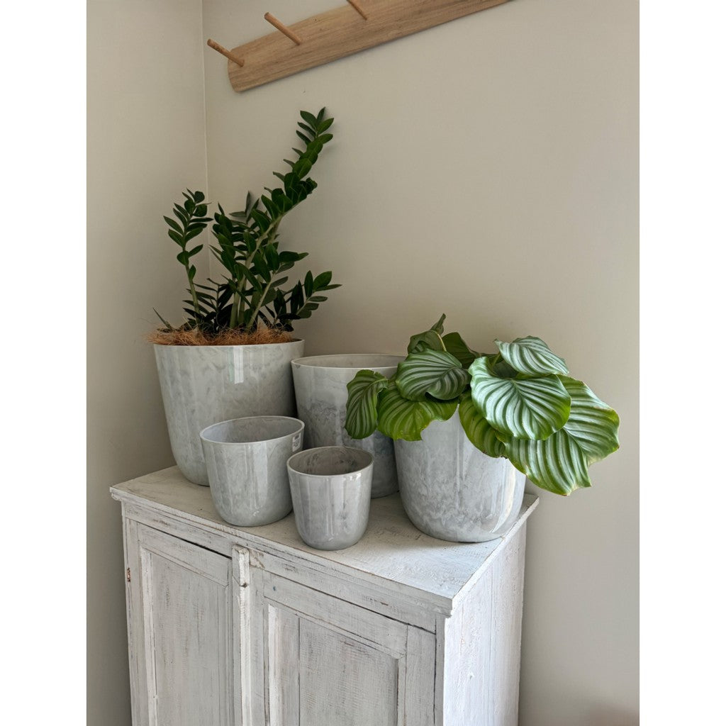 Palermo marble white pots on a white cabinet