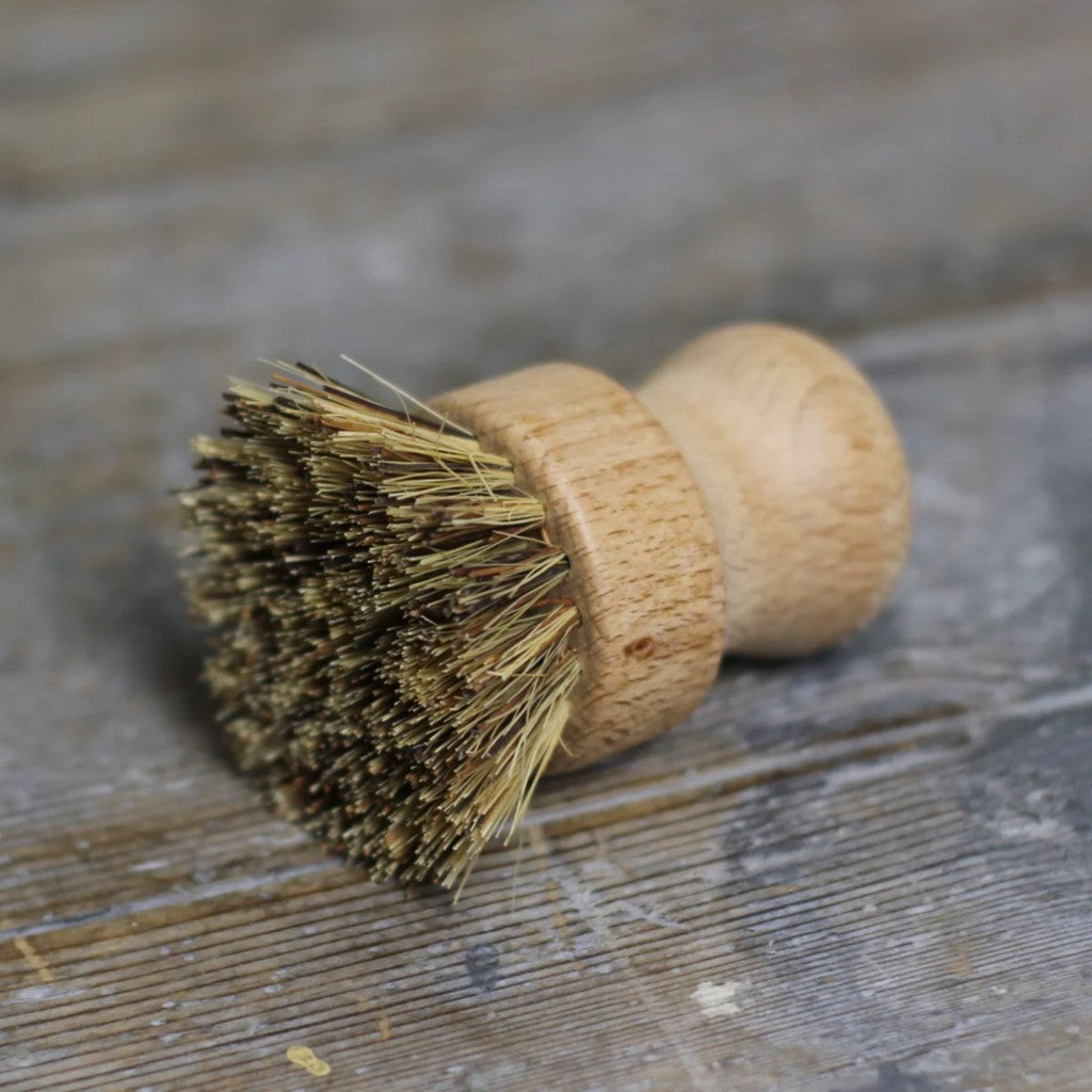 Pot brush on a rustic timber bench