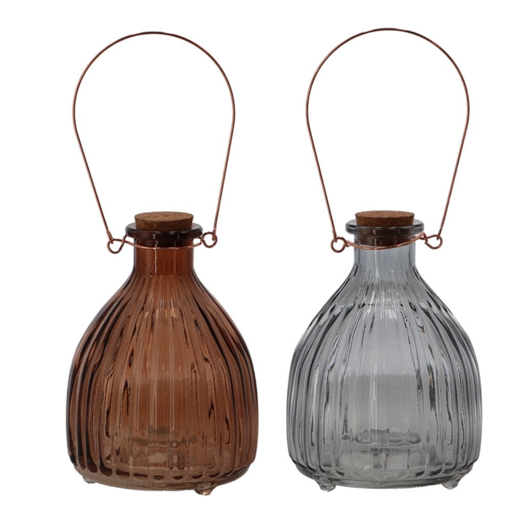 Amber and grey glass wasp traps on white