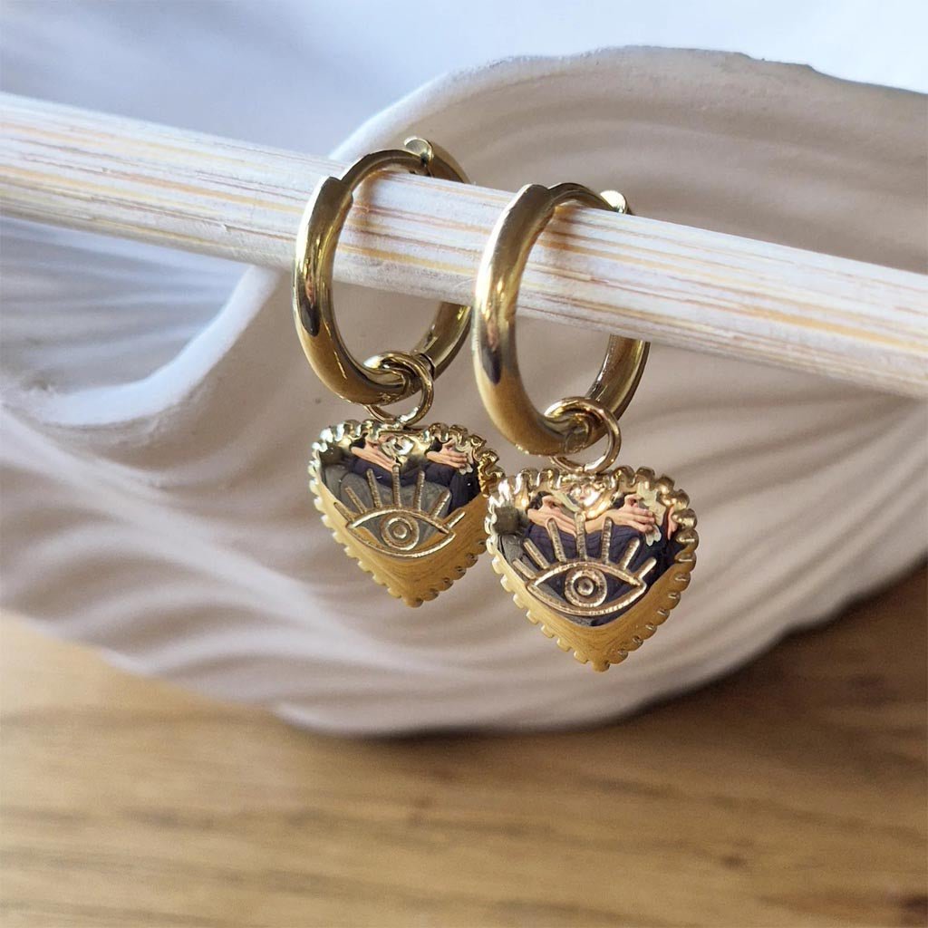 Sorella Of May | Vela Evil Eye Heart Stainless Gold Plated Huggie Earring - Cove. Beach Essentials