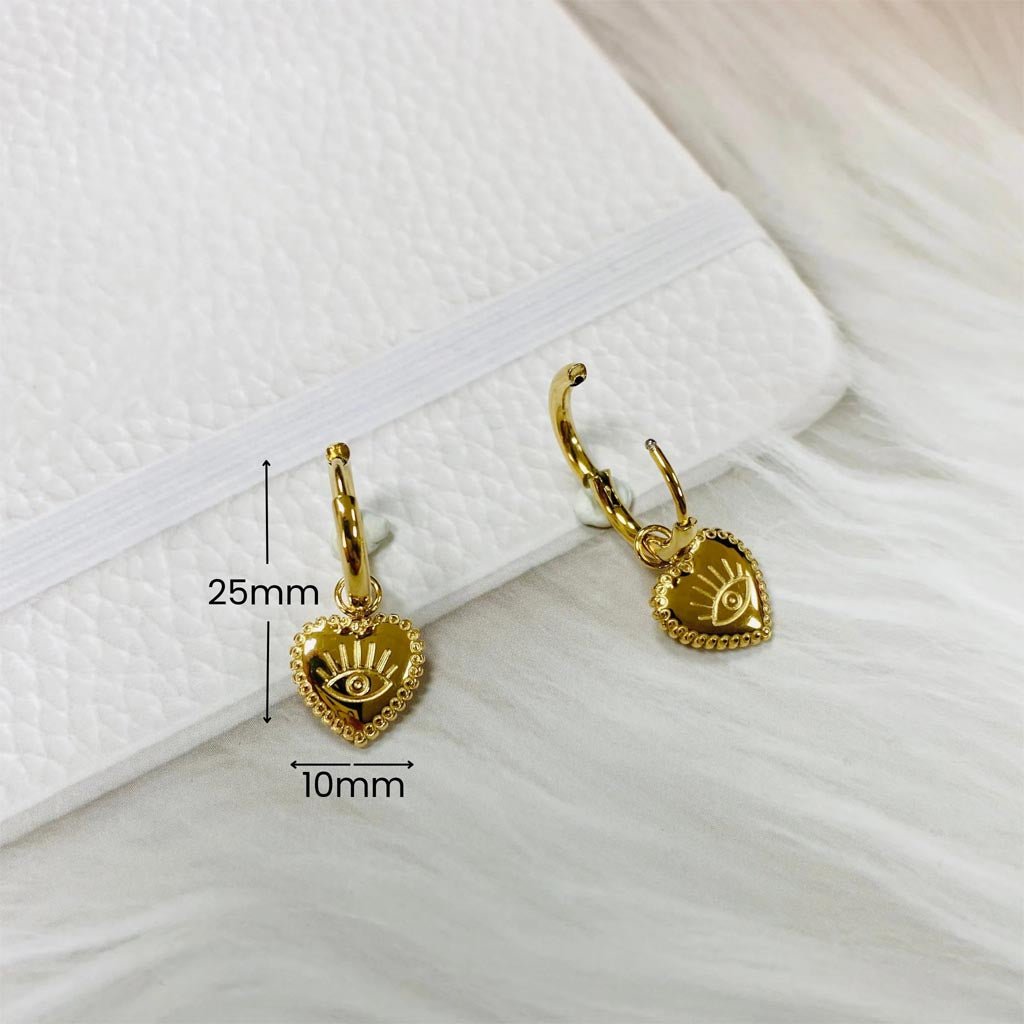 Sorella Of May | Vela Evil Eye Heart Stainless Gold Plated Huggie Earring - Cove. Beach Essentials