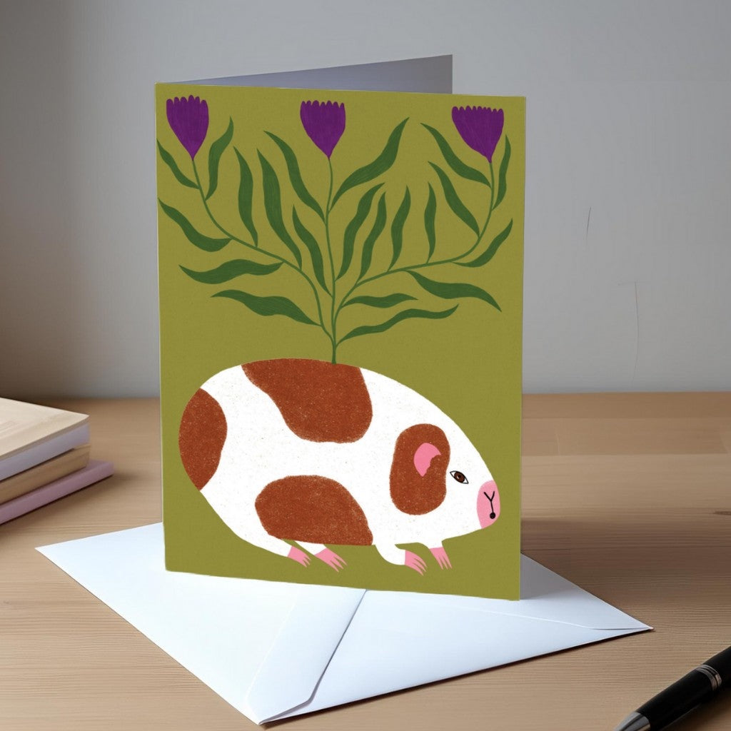 Studio Soph Guinea Pig greeting card on a desk with envelope