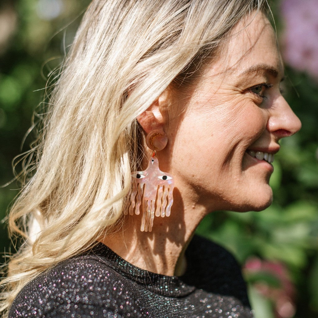 Model wearing Studio Soph Big Birds Galaxy Pink earrings, side view
