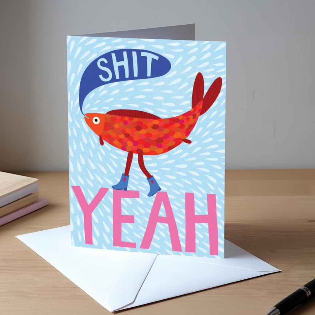 Studio Soph Shit Yeah greeting card on a desk with envelope