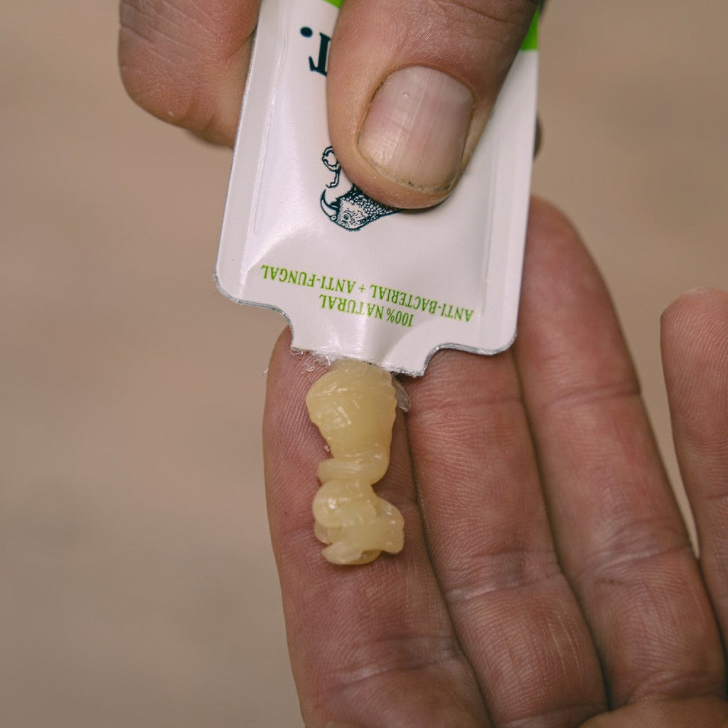 Anti Chafe Gel squeezed from the 8 ml sachet into a palm