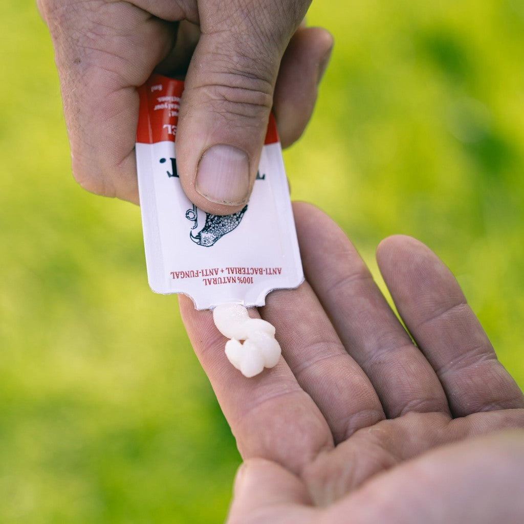 First Aid Gel squeezed from the 8 ml sachet into a palm