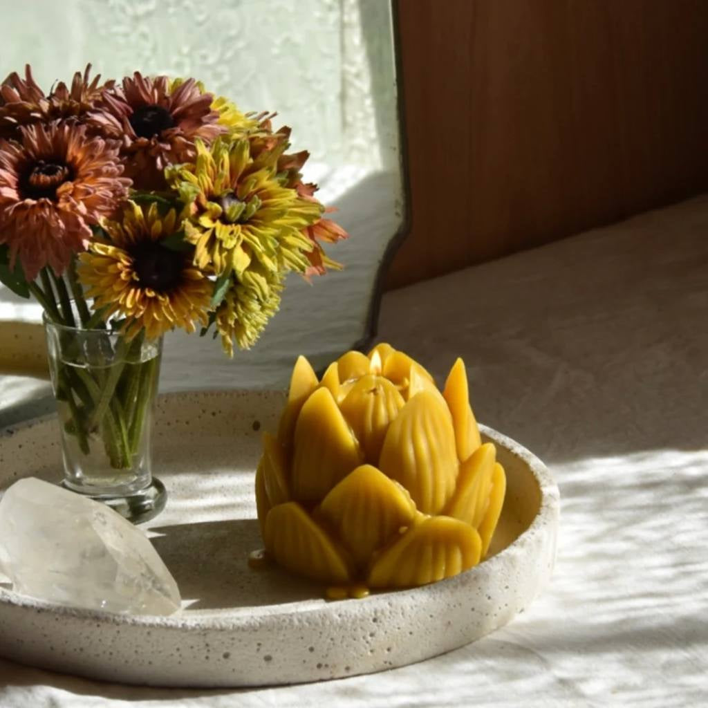 A large jar of The Authentic Honey Co. Lotus Natural Honey with a golden hue, featuring a minimalist label design against a white background.